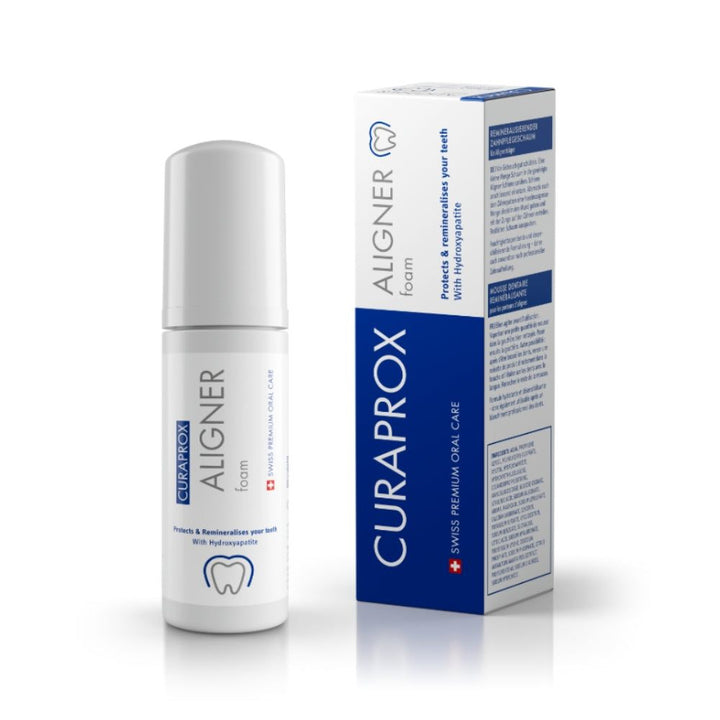 Curaprox Aligner Foam product image showing the bottle and packaging. The label highlights its benefits: protects and remineralises teeth with hydroxyapatite. The packaging features a clean white and blue design with "Swiss Premium Oral Care" branding.