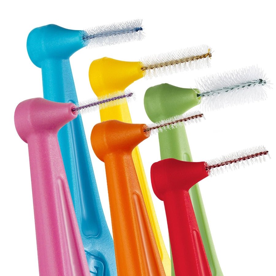 Close up of Tepe Angle Interdental brush heads in multiple colour coordinated sizes.