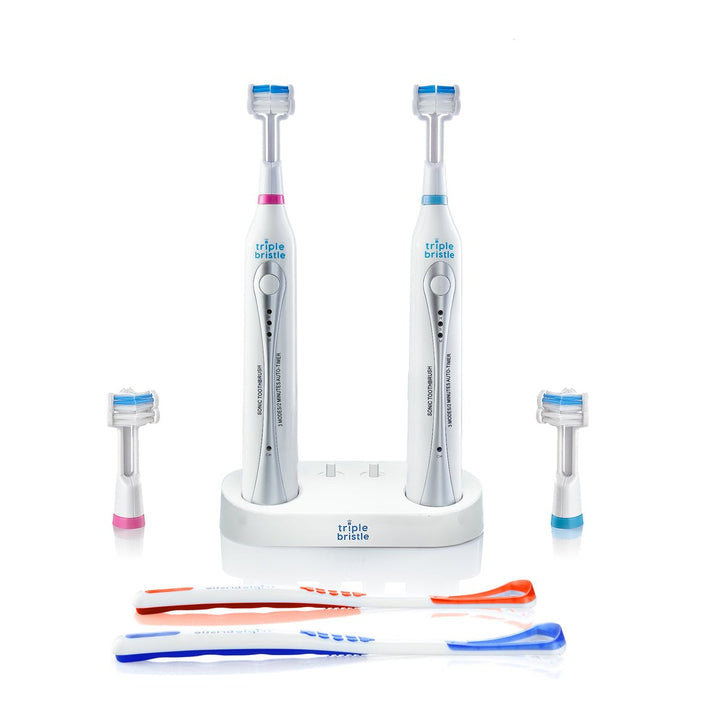 Triple Bristle Sonic electric toothbrush set with multiple brushes and a stand on a white background