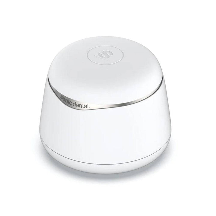 White Sonic Pro dental appliance cleaner with 'Sonic Dental' branding on a white background