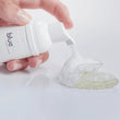 Load image into Gallery viewer, Bluem oral foam being applied to a clear aligner for cleaning
