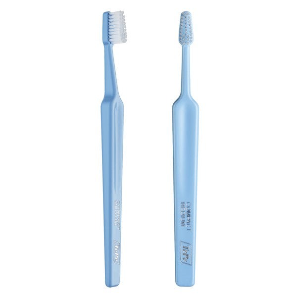 TePe Select Compact Medium Toothbrush with tapered head and end-rounded filaments.